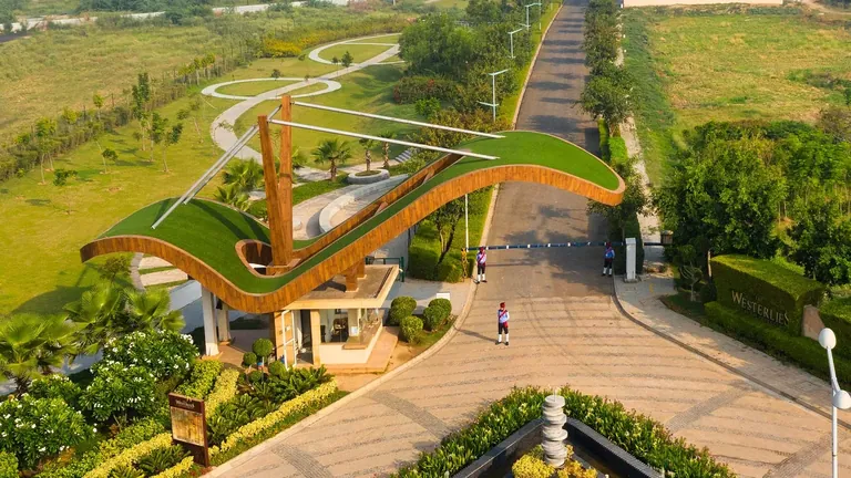 Experion The Westerlies aerial view of the arched entrance gate and main avenue, actual photo