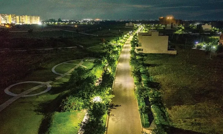 Experion The Westerlies internal avenue with street lights at night, actual photo