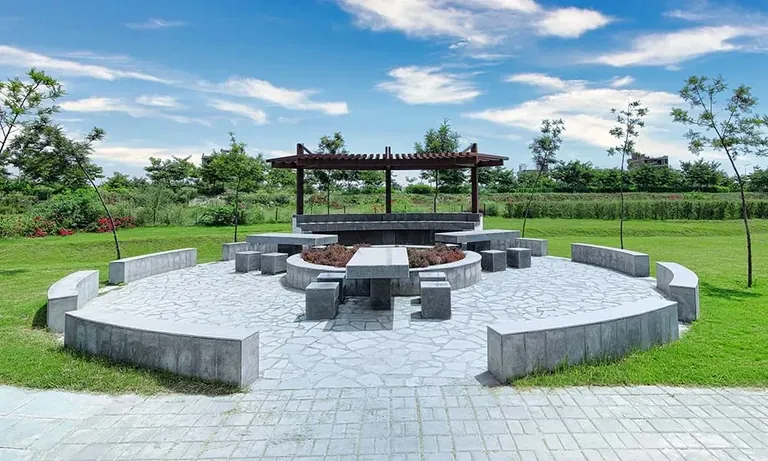 Experion The Westerlies pergola with stone seating circle, actual photo