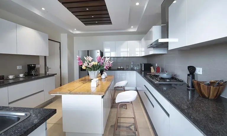 Experion Windchants 4 BHK apartment modular kitchen with island, actual photo