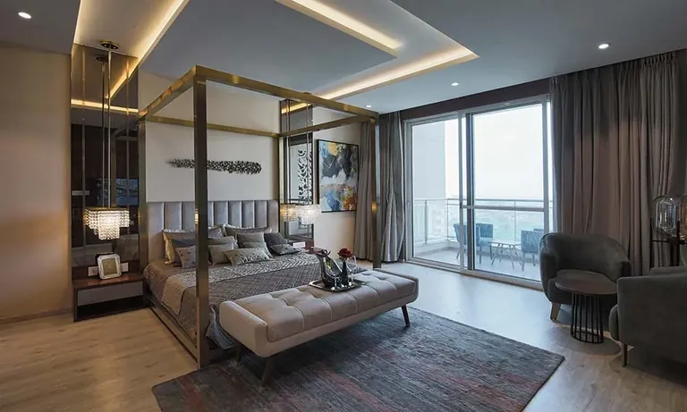Experion Windchants 4 BHK apartment bedroom with balcony view, actual photo