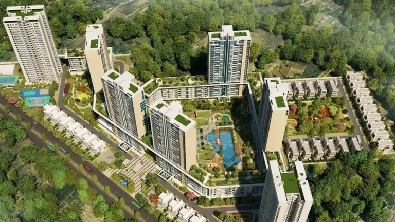 Experion Windchants aerial view of the seven towers, skywalk and villaments amid greenery, artist's impression