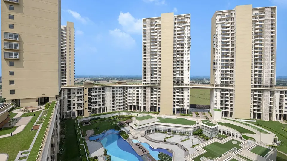 Experion Windchants towers and swimming pool seen from the seventh-level skywalk, actual photo