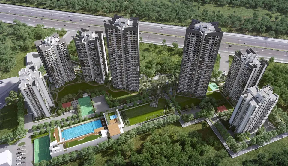 Godrej Meridien aerial view of the seven towers, central greens and pool beside Dwarka Expressway, artist's impression