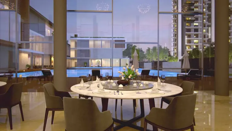 Godrej Meridien clubhouse dining area overlooking the pool, artist's impression