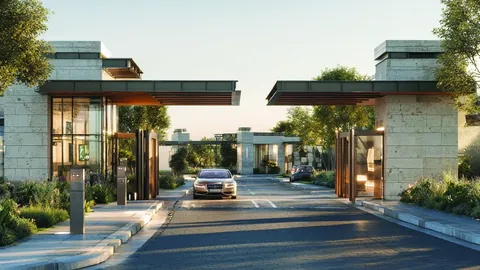 Godrej Samaris entry gates and tree-lined entrance road