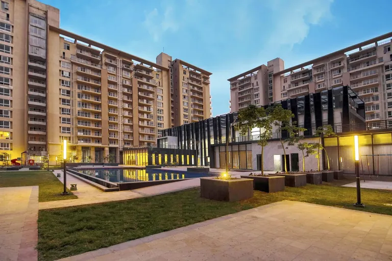 Indiabulls Enigma pool and landscaped lawn at dusk, photo