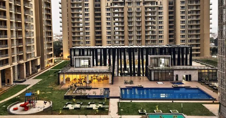 Indiabulls Enigma swimming pool, kids' play area and clubhouse seen from above, photo