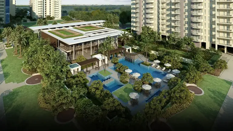Ireo The Corridors clubhouse with green roof beside the pool deck and gardens, artist's impression
