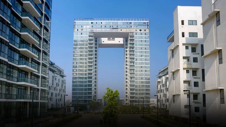 Ireo The Grand Arch arch tower seen between the low-rise blocks