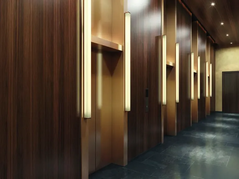 Krisumi Waterfall Suites lift lobby in dark timber and stone, artist's impression