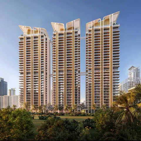 M3M Altitude three towers with crown tops and linking air bridge by day, artist's impression
