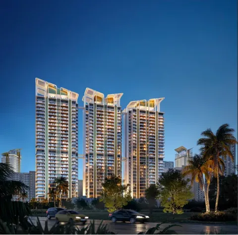 M3M Altitude towers lit up in the evening above palm-lined landscaping, artist's impression
