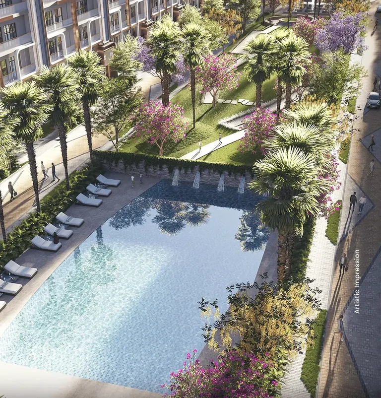 M3M Antalya Hills swimming pool framed by palms and flowering trees, artist's impression