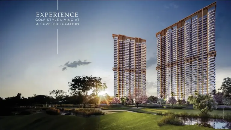 M3M Capital towers at sunset beyond the golf putting green, with M3M's golf-style living tagline, artist's impression