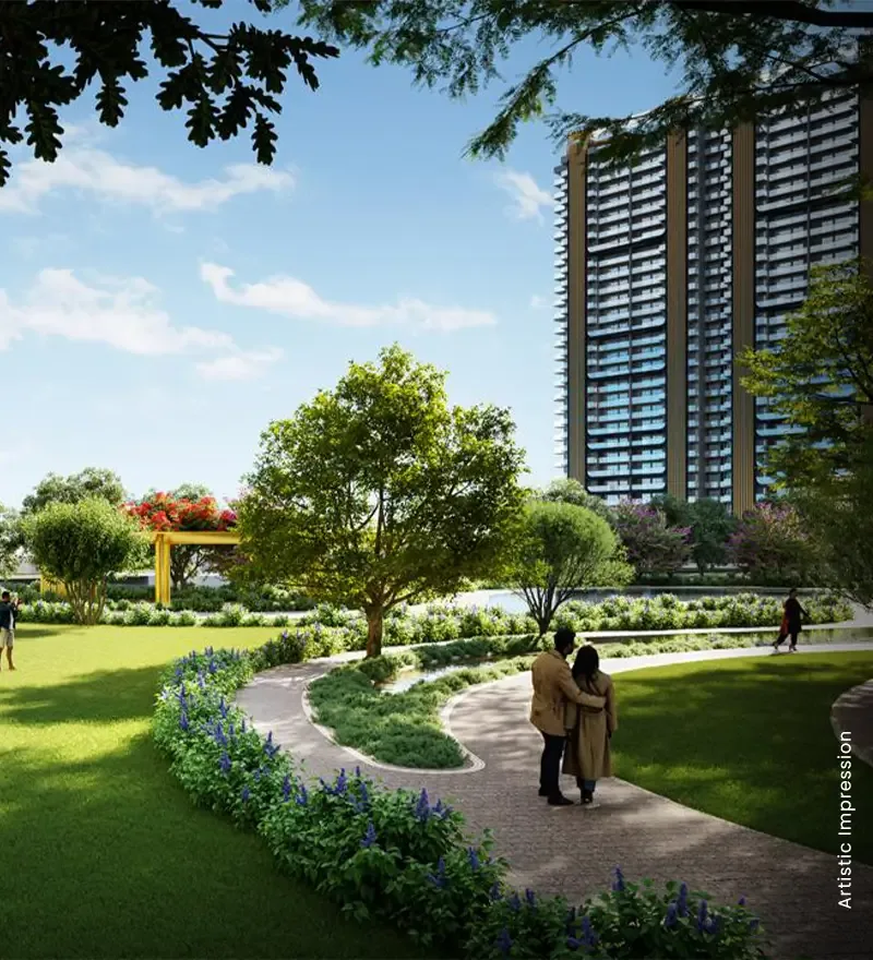 M3M Crown garden walk between the towers with a family on the path, artist's impression