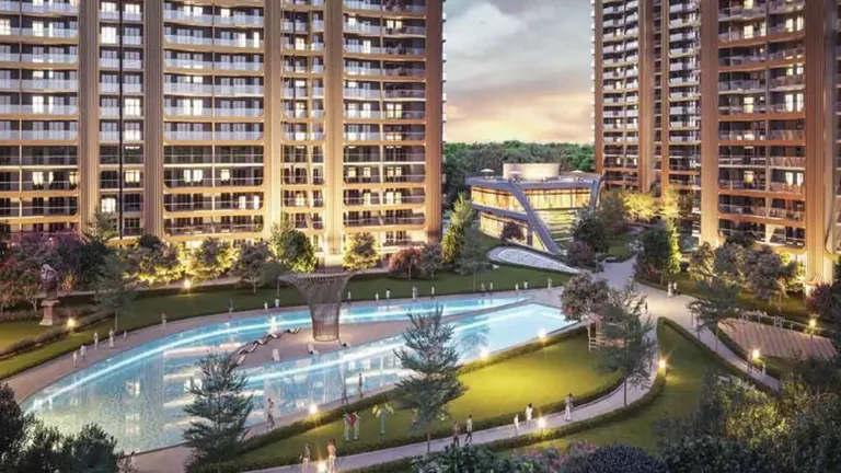 M3M Crown towers around the lit pool deck at night, artist's impression