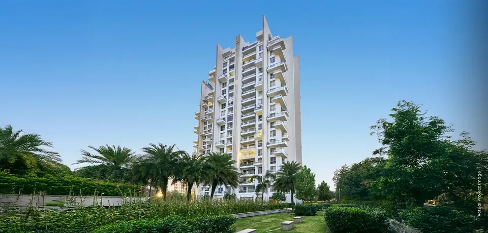 M3M Escala actual photo of the tower rising above landscaped gardens