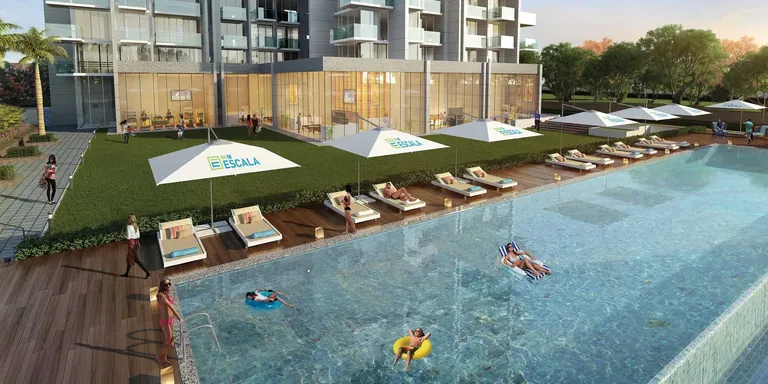 M3M Escala swimming pool deck with loungers and umbrellas, artist's impression