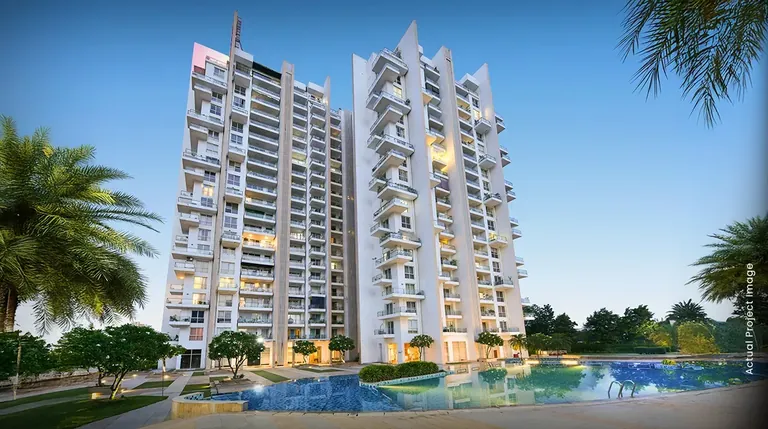 M3M Escala towers behind the swimming pool at dusk, artist's impression