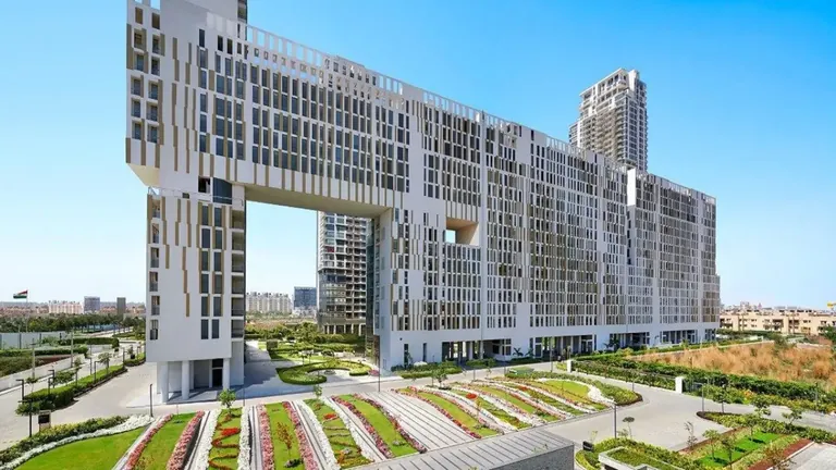 M3M Golfestate residential block with its open sky archway above the terraced flower gardens