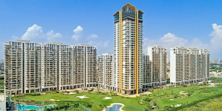 M3M Golfestate St Andrews tower and Fairway towers beside the golf course, artist's impression