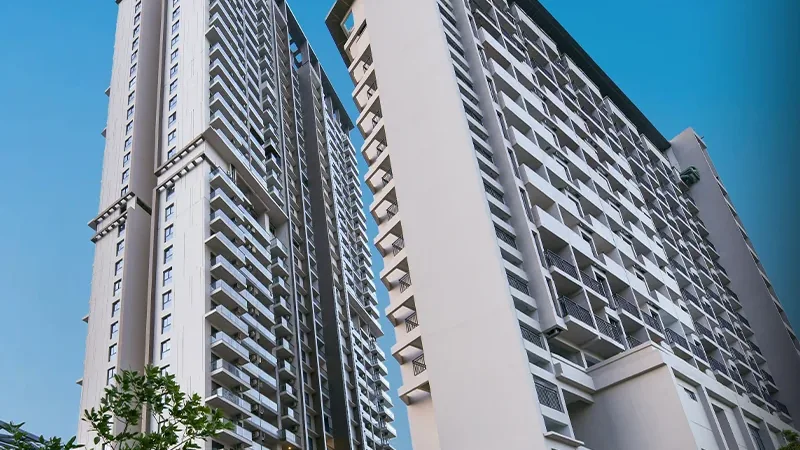 M3M Heights completed residential towers photographed from the ground on a clear day