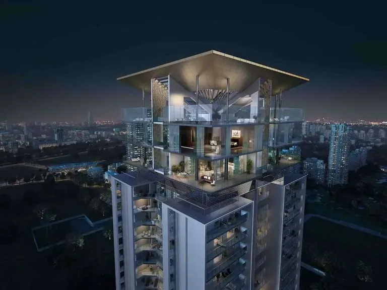 M3M Latitude glass-walled top floors and roof canopy lit at night, artist's impression