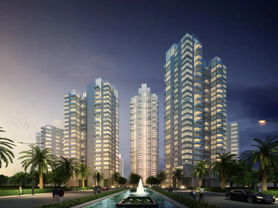 M3M Merlin towers lit up at night above the fountain boulevard, artist's impression