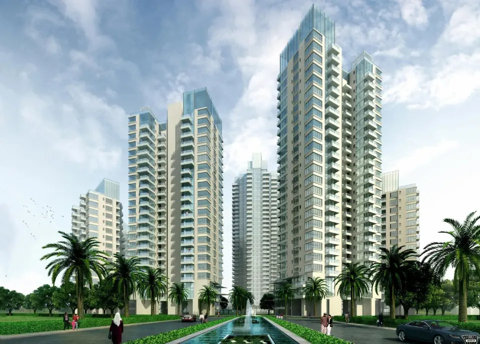 M3M Merlin towers seen along the palm-lined entrance boulevard by day, artist's impression