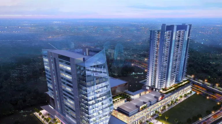 M3M Skywalk aerial evening view of the towers and office block, artist's impression