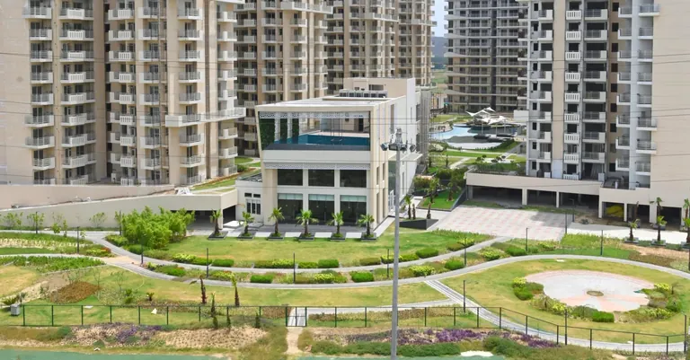 M3M The Marina actual photo of the clubhouse, greens and towers
