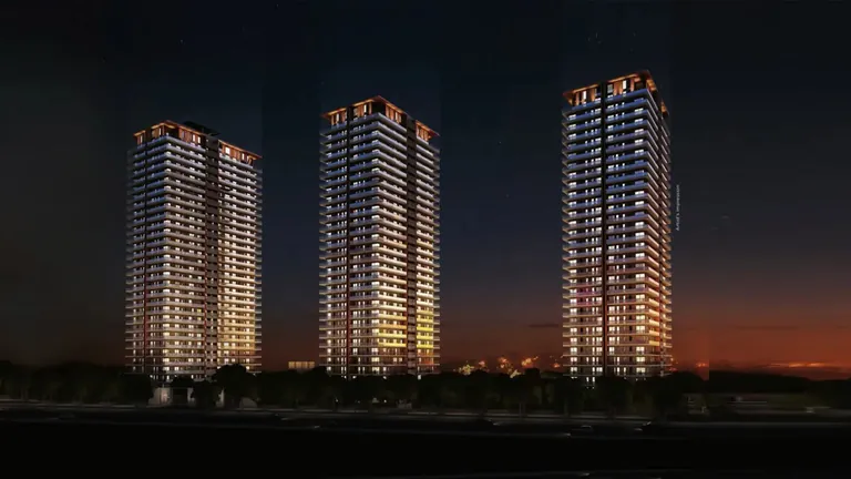 Mahindra Luminare three towers lit at dusk