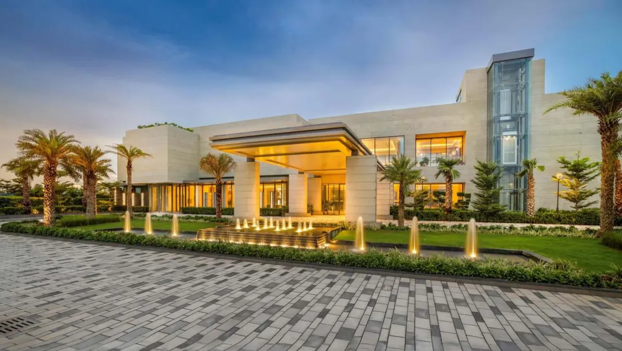 Puri Diplomatic Greens clubhouse building at dusk