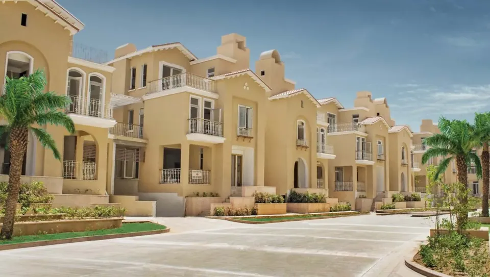 Puri Diplomatic Greens villas along an internal street