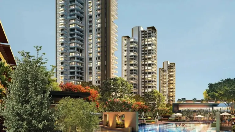 Puri Diplomatic Residences towers and pool deck from the garden, artist's impression