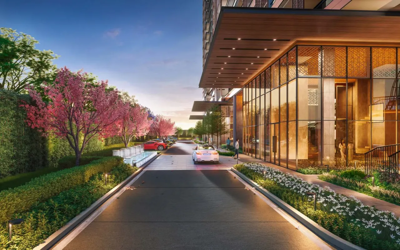 Puri Diplomatic Residences internal road with flowering trees between the towers, artist's impression
