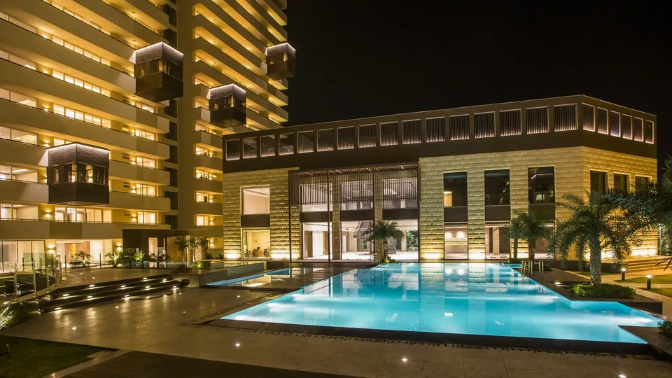 Salcon The Verandas pool and towers at night, Golf Course Road Sector 54