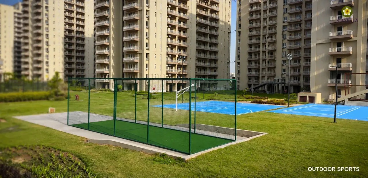 Silverglades The Melia First Citizen cricket nets and courts beside the towers