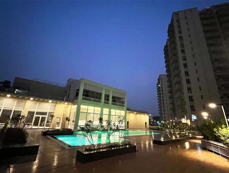 Silverglades The Melia clubhouse and pool lit up at night