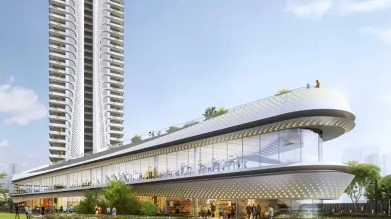 Smartworld The Edition clubhouse with curved glass facade beneath the tower, artist's impression