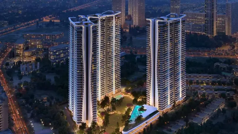 Smartworld The Edition twin towers lit up at night above the Sector 66 skyline, artist's impression