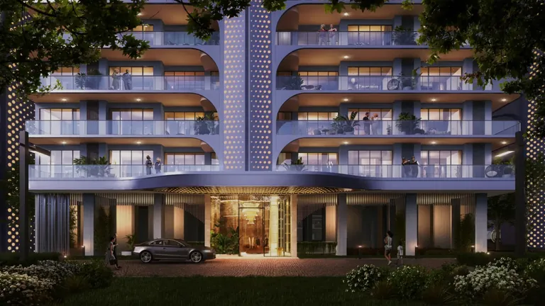 Smartworld The Edition tower entrance and drop-off lit up in the evening, artist's impression