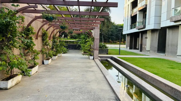 Tata Primanti pergola walkway and landscaped garden