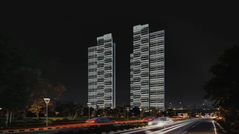 Tonino Lamborghini Residences towers lit up at night from the SPR, artist's impression
