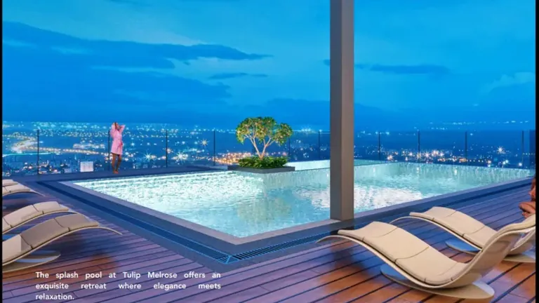 Tulip Melrose rooftop pool with sun loungers overlooking the city at night, artist's impression