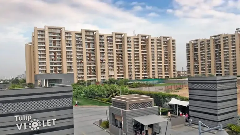 Tulip Violet entrance with project sign, security cabin and residential towers, Sector 69 Gurgaon